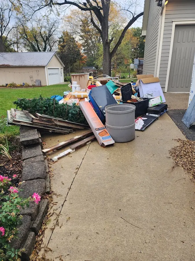 Dumpster being loaded with debris for Demolition Dumpster Rental in Waldoboro